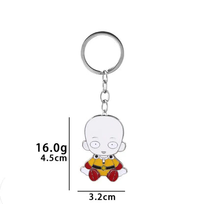 A shiny silver saitama metal keychain featuring a small seated saitama character in yellow and red outfit