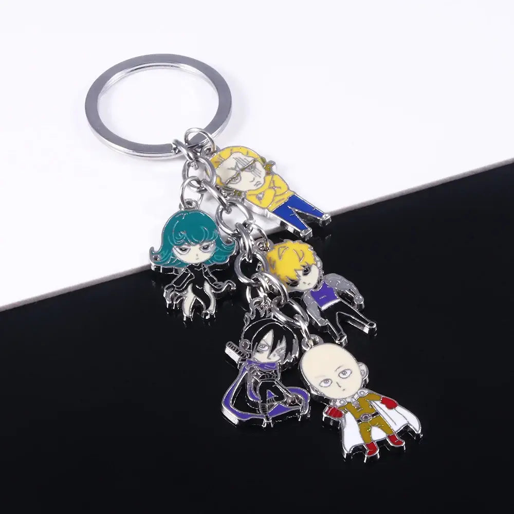 A saitama metal keychain featuring five colorful chibi-style enamel charms from one punch man in vibrant colors