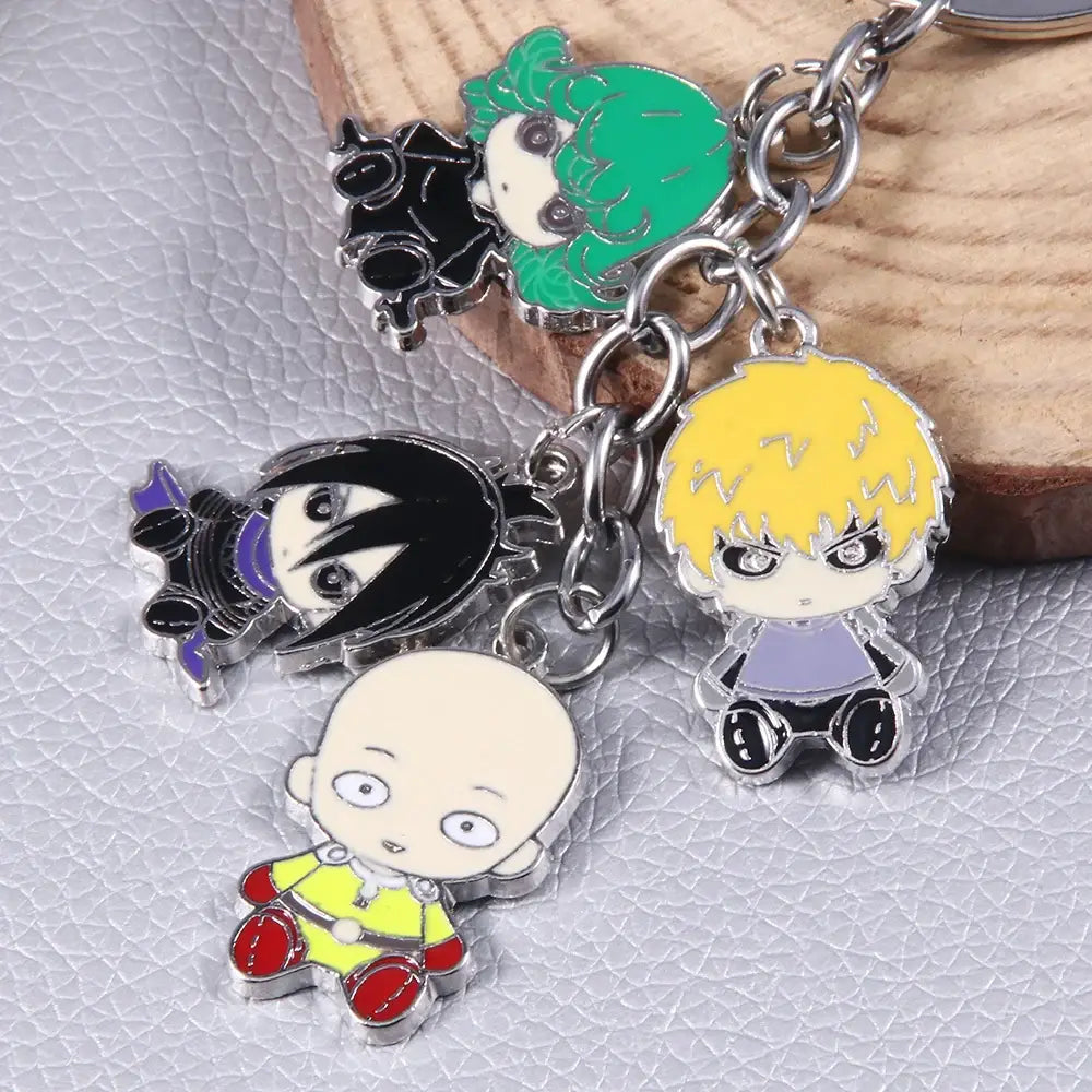 A set of colorful enamel punch man saitama chibi keychains on a silver chain featuring saitama metal keychain design