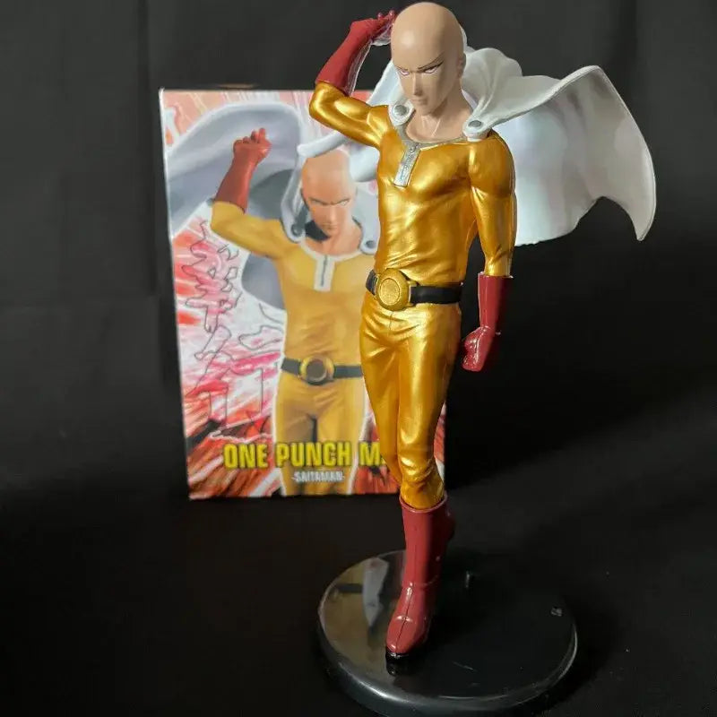 Golden saitama pvc action statue in shiny metallic suit with red gloves boots and white flowing cape from punch man