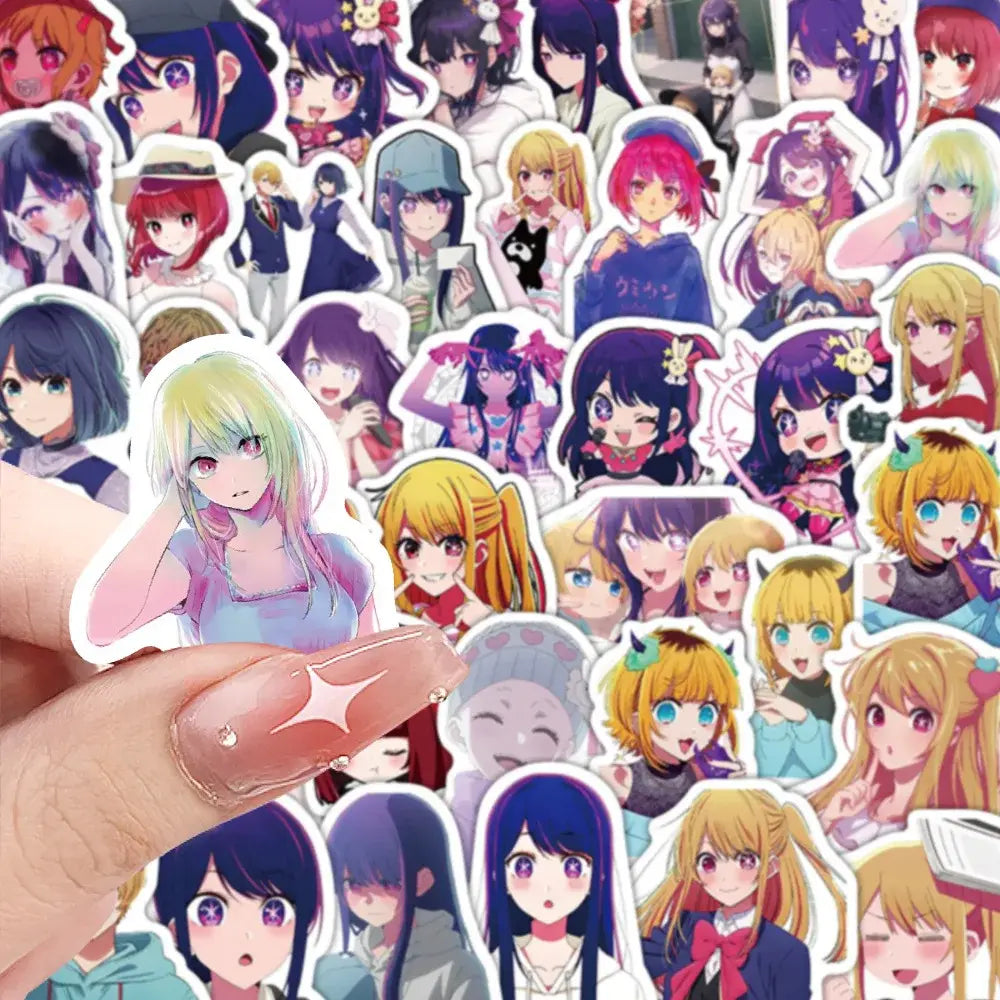 A hand holds a colorful hoshino sticker with pastel green hair and pink eyes from 50pcs aesthetic diy scrapbook kit