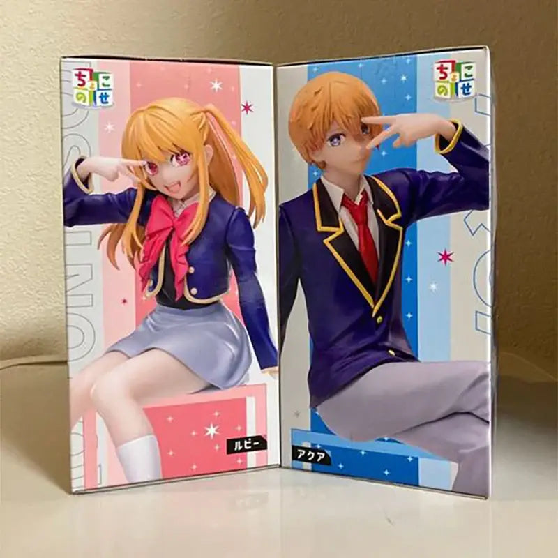 Two anime figure collectibles featuring ruby pvc and hoshino aqua in navy blue school uniforms in packaging