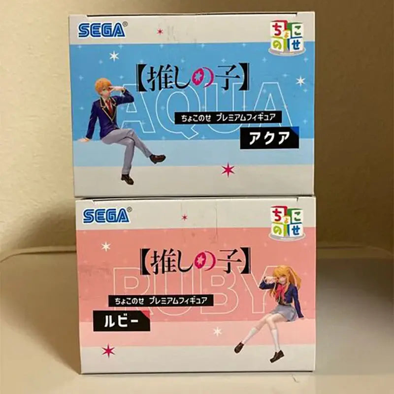Two sega choco-se premium pvc figures featuring aqua and ruby from oshi no ko with blue and pink color schemes