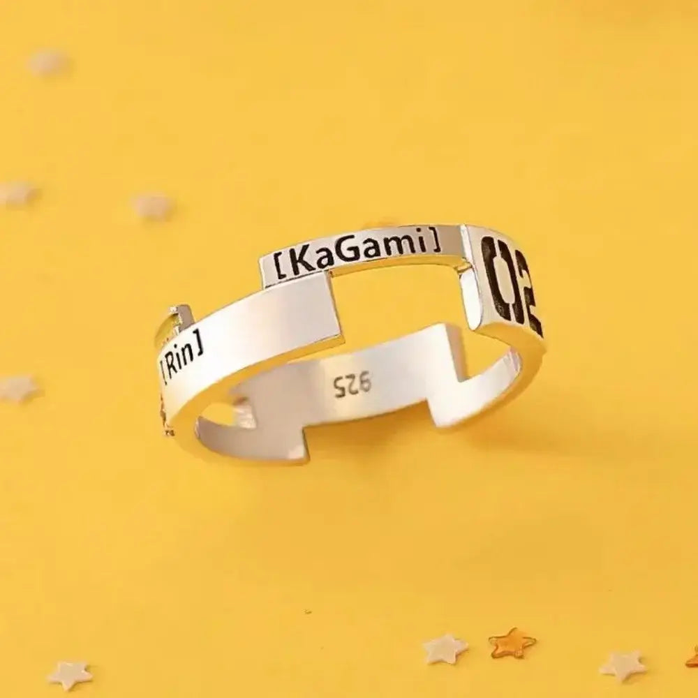 A sleek silver ring made of 925 sterling silver featuring a modern segmented design with kagamine rin engraving