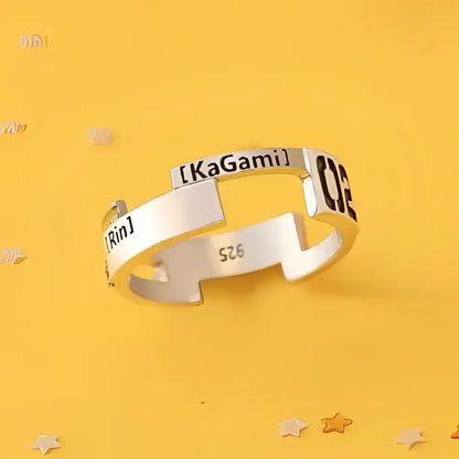 A sleek silver 925 sterling silver ring with modern segmented design engraved with kagamine rin and kagamii