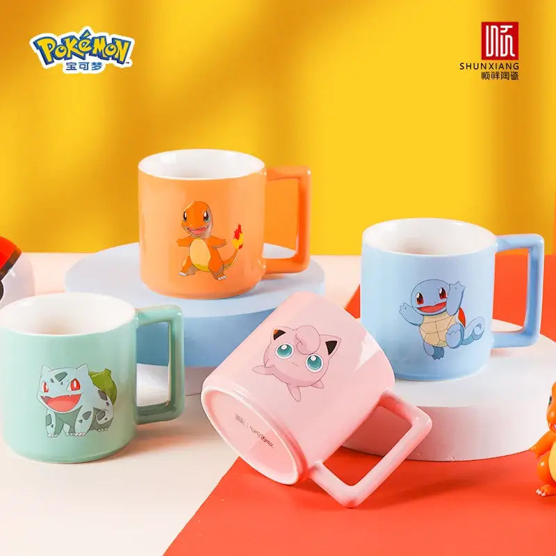 Pastel-colored ceramic mug featuring popular pokémon characters bulbasaur charmander squirtle and jigglypuff for coffee or tea