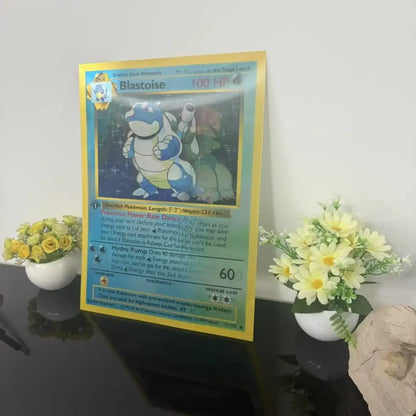 A framed blastoise pokémon card with yellow border and blue artwork featured as wall art lenticular poster