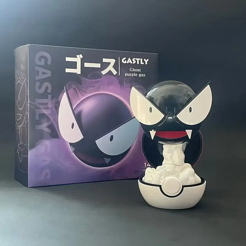 Pokemon gastly humidifier night light featuring a black and white figurine with red mouth emerging from a white poké ball base