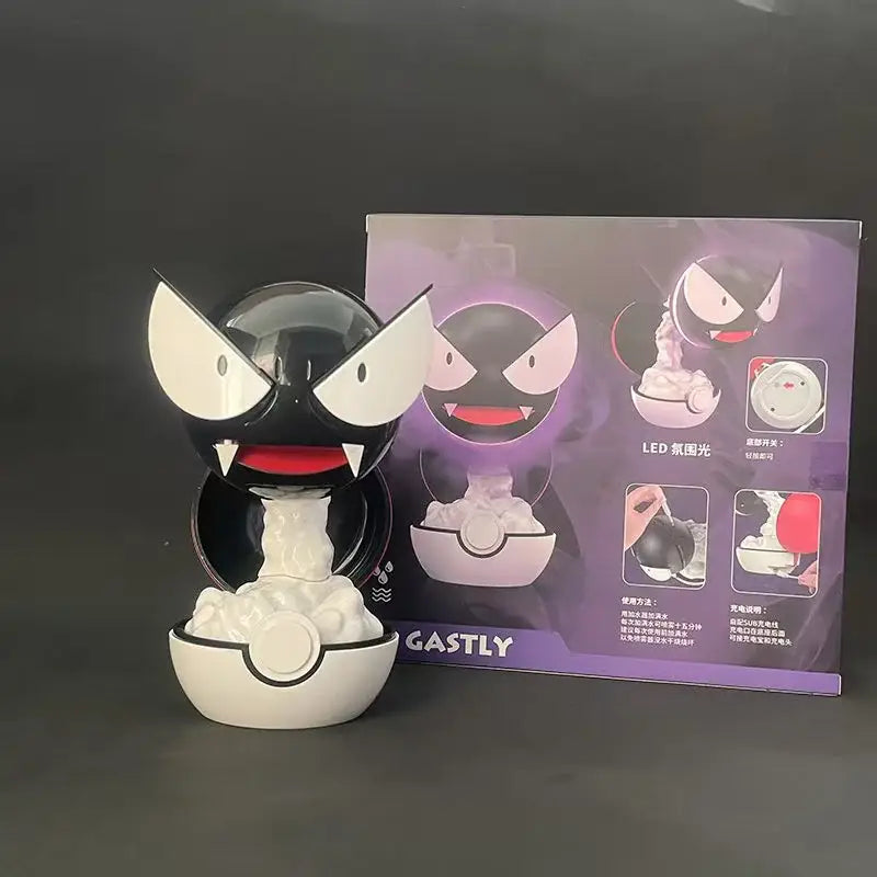 Pokemon gastly humidifier night light featuring a black and white led toy with glowing red eyes in a poké ball base