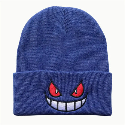 Blue knitted winter hat featuring an embroidered gengar face with red eyes and a toothy grin