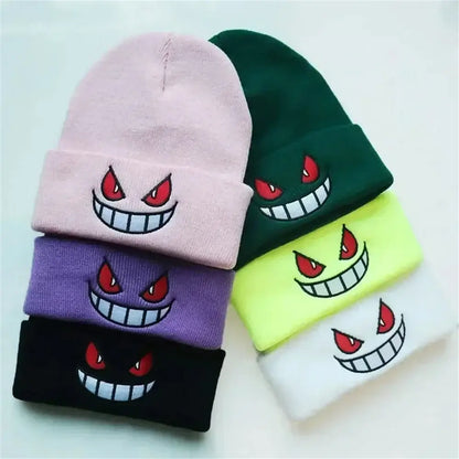 A collection of five colorful pokemon gengar knit beanies with embroidered cartoon faces and red eyes winter hats