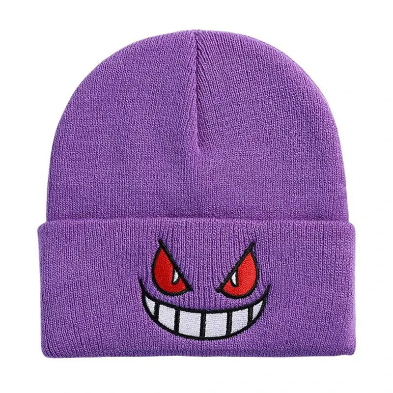 Purple knitted beanie winter hat featuring an embroidered Gengar face with red eyes and a wide grin