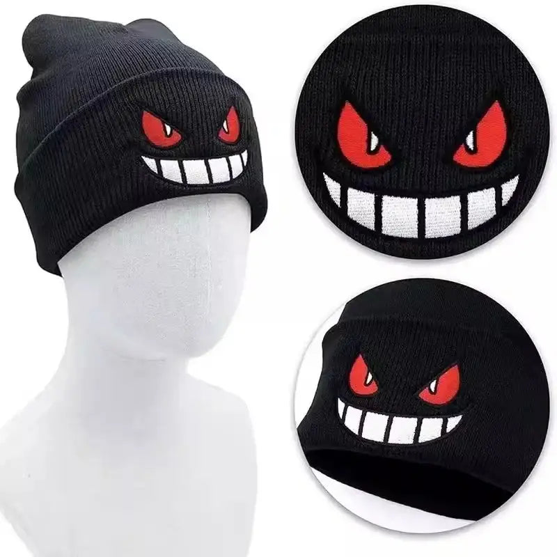 Black knitted beanie featuring bold embroidered gengar face with red eyes and white teeth winter hat for warmth