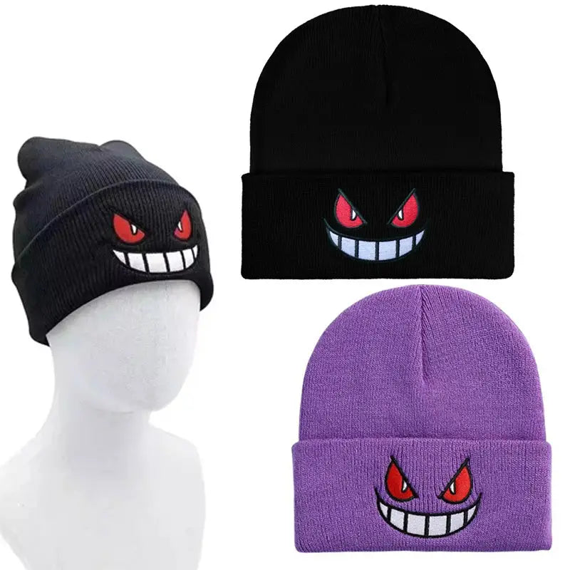 Black and purple knitted beanie with embroidered red eyes and wide white grin winter hat inspired by pokemon gengar