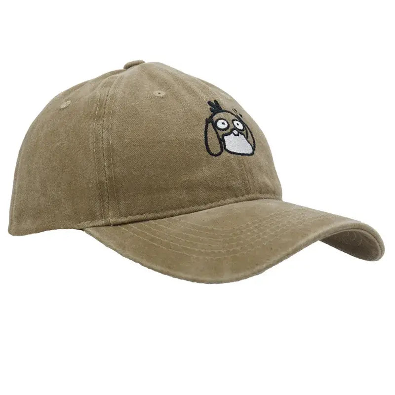 Beige cotton baseball cap with a black and white embroidered kawaii character dog face in a plush knitted hood hat style