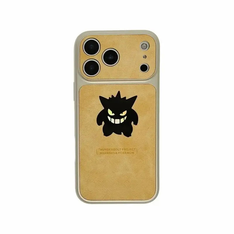 Gold-colored leather phone case with black gengar silhouette and glowing green eyes featuring laser leather texture back design