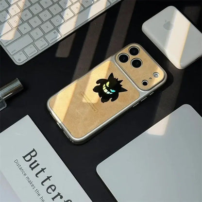 Back of gold-colored phone case with black gengar sticker and glowing blue eyes featuring laser leather texture