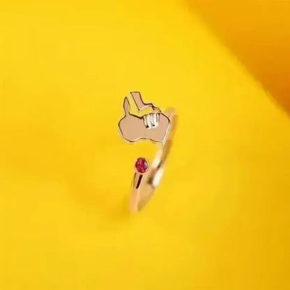 Rose gold 925 silver couple ring featuring a stylized hand gesture with an embedded red gemstone inspired by pokemon