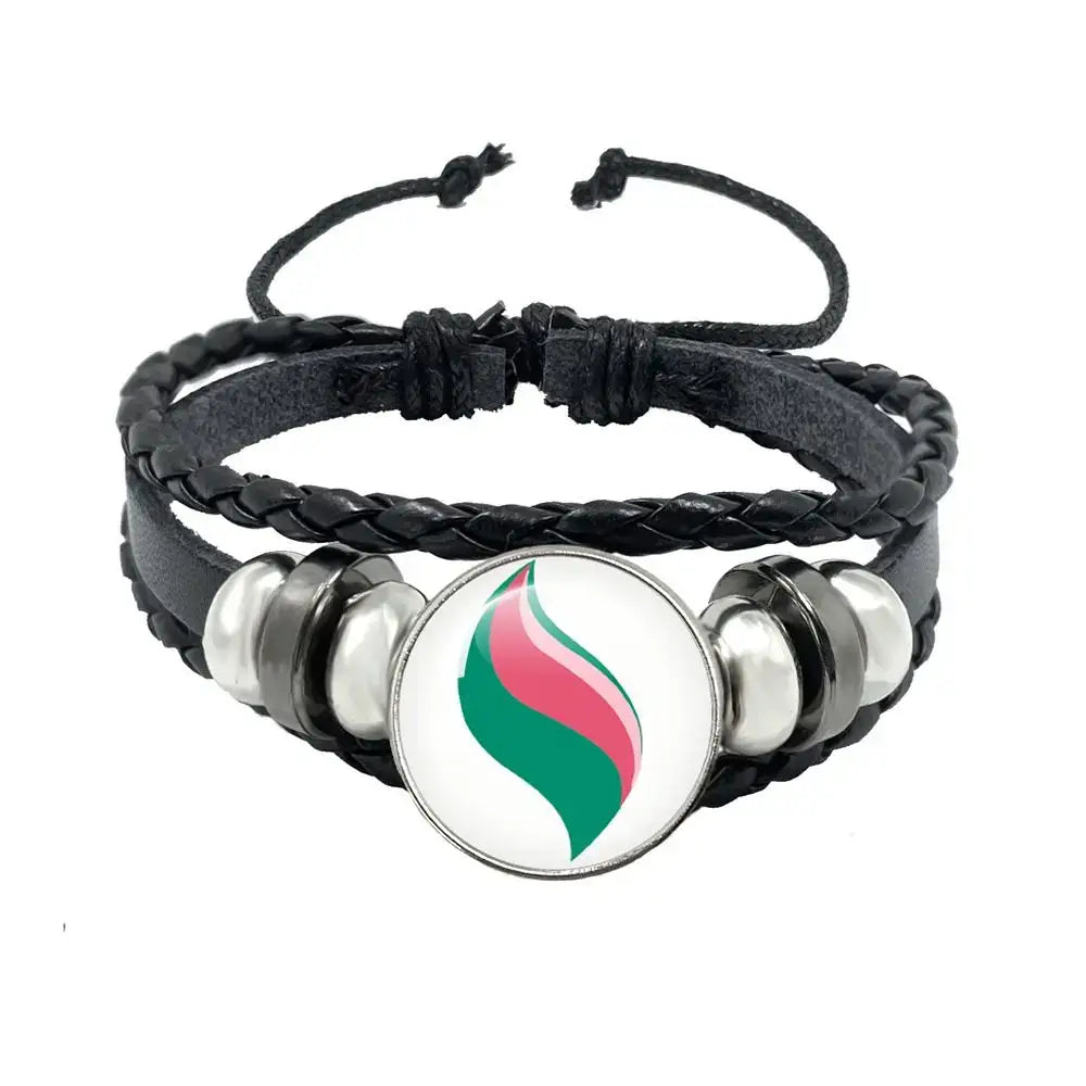 Black braided leather rope bracelet with central pink and green flame charm and silver-toned beads in black leather