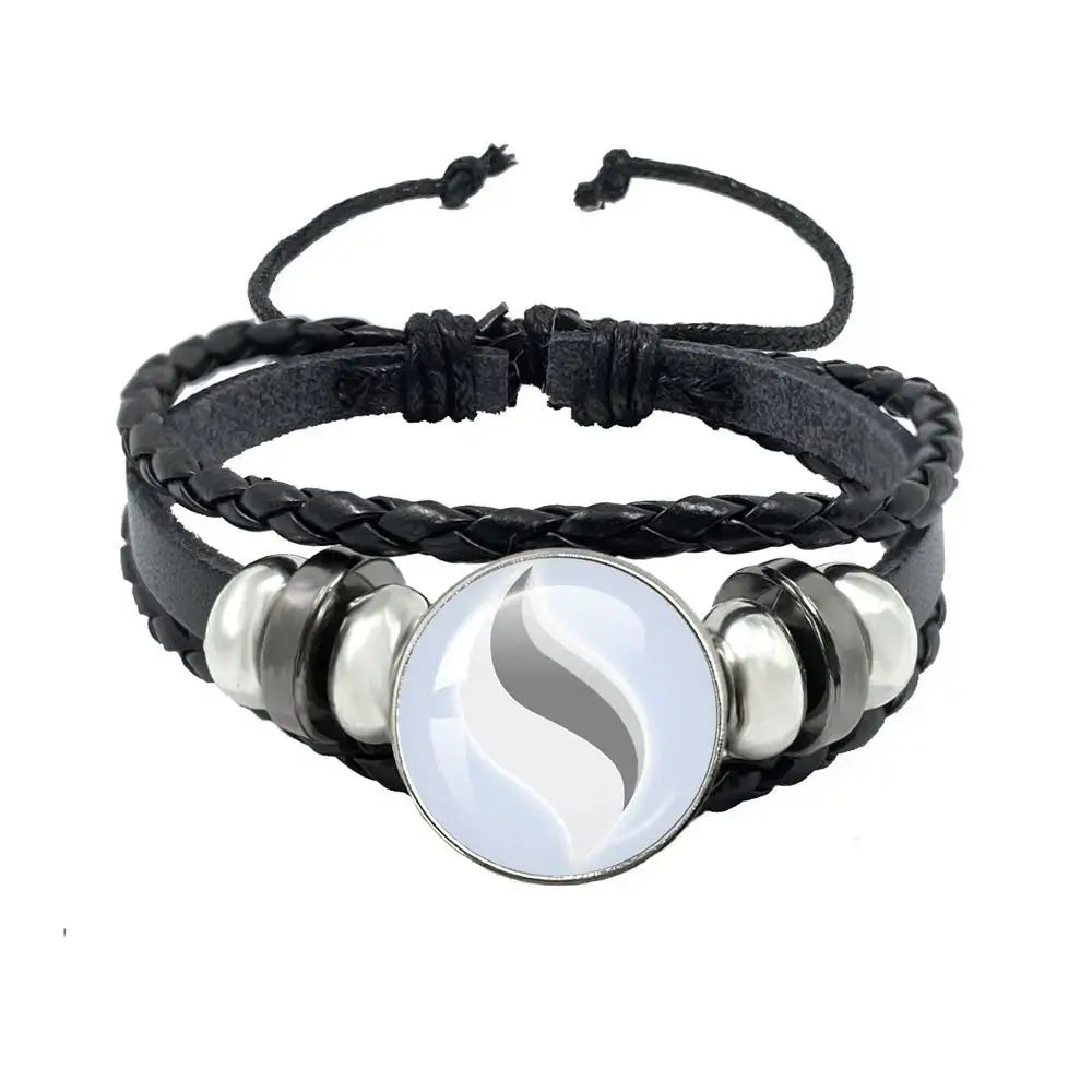 Pokemon mega stone keychain featuring black leather rope bracelet with silver s charm and metallic beads