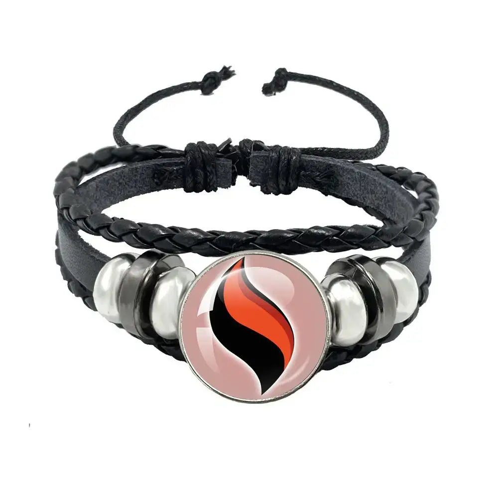 Black braided leather bracelet with black leather rope and a circular orange and black flame charm with silver beads