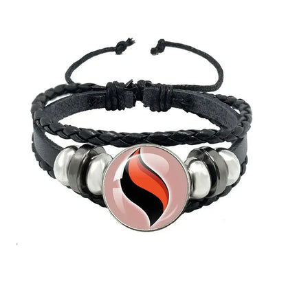 Black braided leather bracelet with black leather rope and a circular orange and black flame charm with silver beads