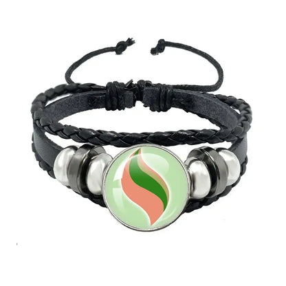 Black braided leather rope bracelet with central green and orange flame charm and silver-toned metallic beads