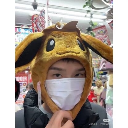Yellow plush Pokemon Pikachu airbag hat with black inner ear linings and pinch ears perfect for winter warm christmas gifts