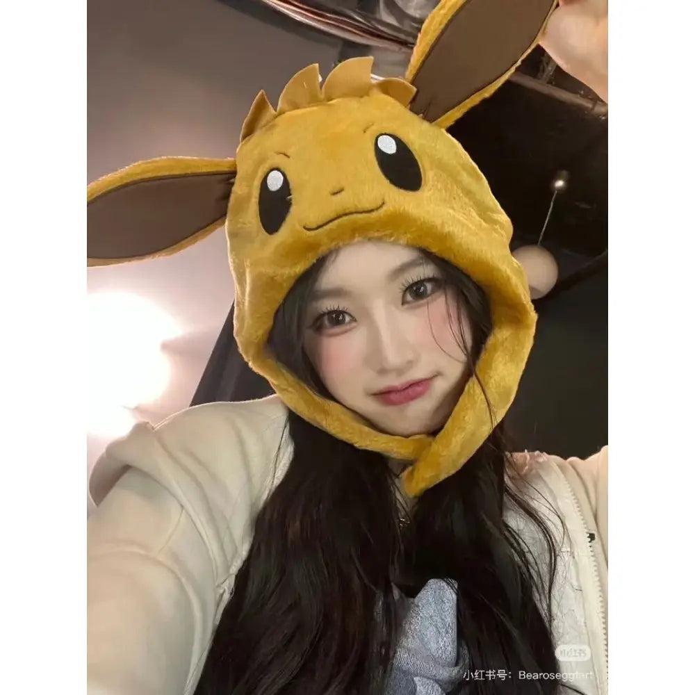 Yellow plush eevee airbag hat with pinch ears brown inner ears and black embroidered eyes ideal for christmas gifts