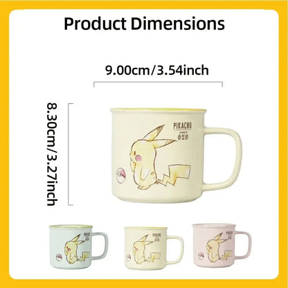 Cream-colored pikachu ceramic mug with yellow pikachu illustration and poké ball available in mint green cream and blush pink