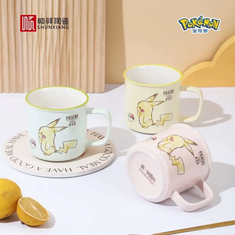 Pastel-colored pikachu ceramic mug with yellow rim featuring shunxiang and pokémon logos in kawaii pattern design