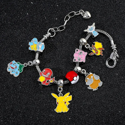 Silver metal bangle charm bracelet featuring colorful enamel pokémon characters including pikachu charm bulbasaur and charmander