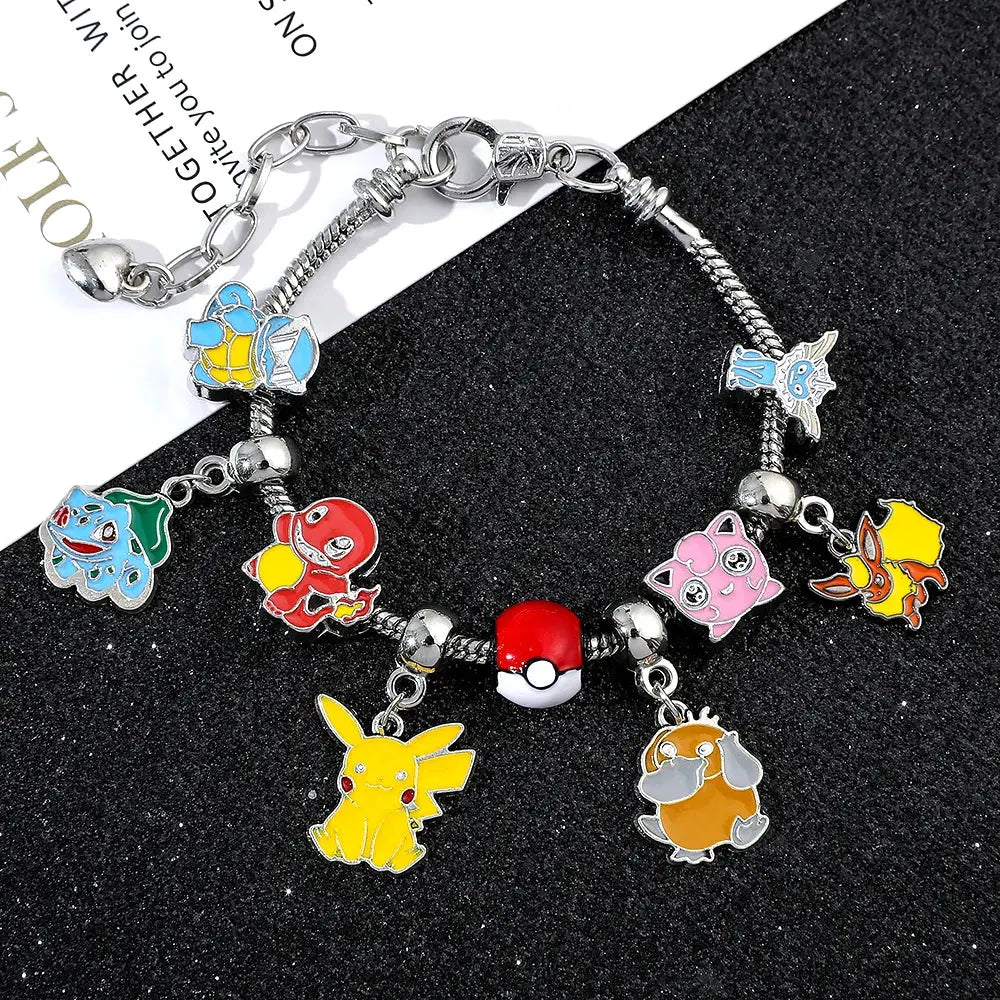 Silver-toned metal bangle charm bracelet featuring colorful enamel pikachu charm and other pokémon character charms