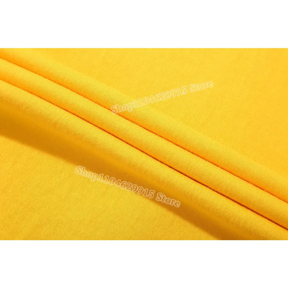 Bright yellow soft cotton fabric with gentle folds in Pokemon Pikachu and Eevee cotton t shirt for kids and adults