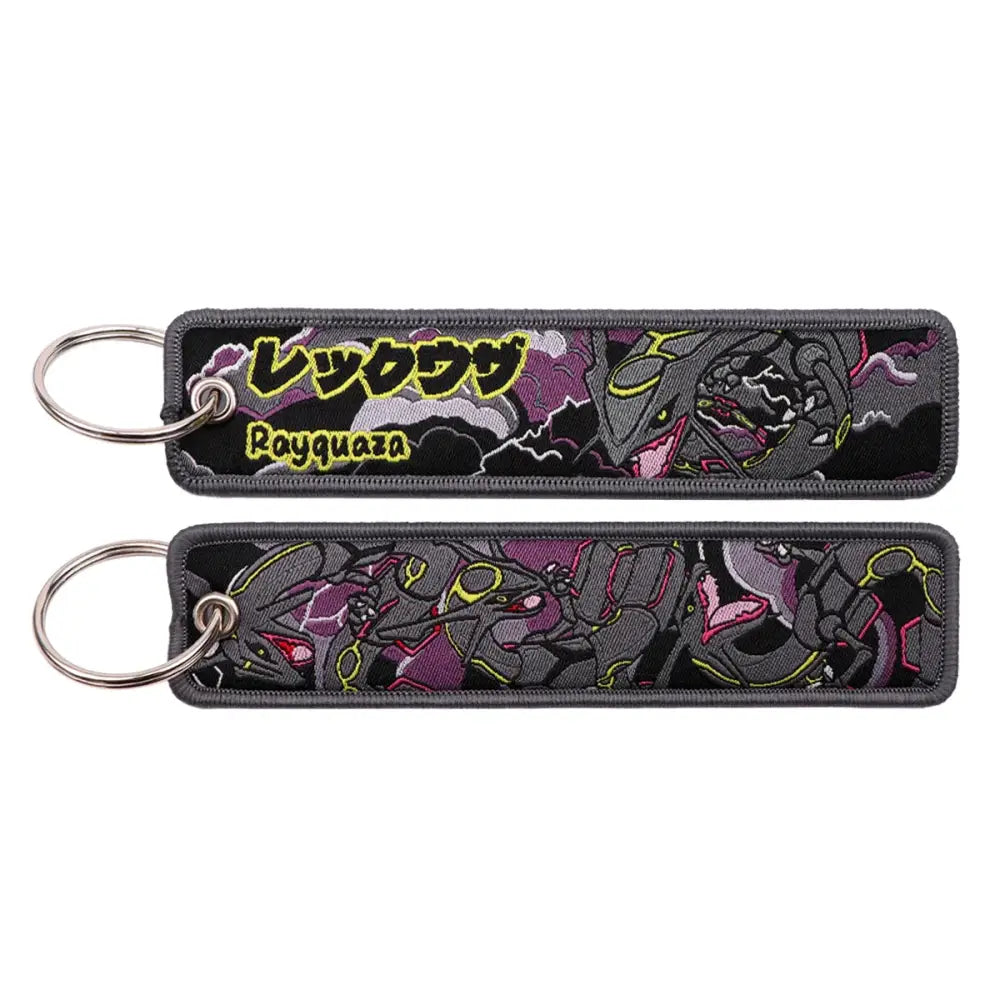 Black embroidered pokemon keychain featuring rayquaza in purple gray and yellow with name in japanese and english