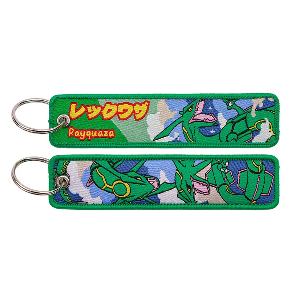 Green embroidered pokémon keychain featuring dynamic rayquaza against sky background with japanese and english text