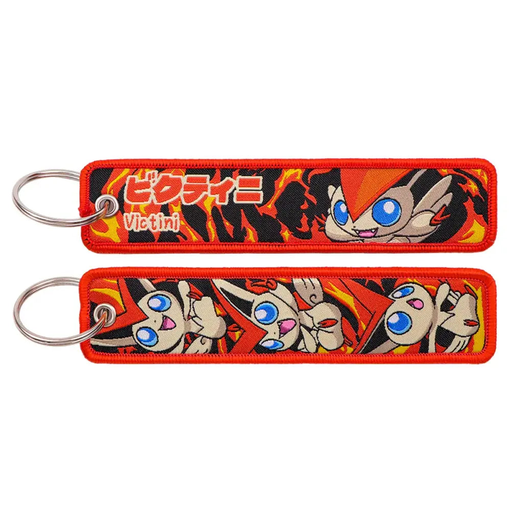 Red embroidered pokemon pikachu keychain featuring victini fiery design with japanese text jet tag accessory