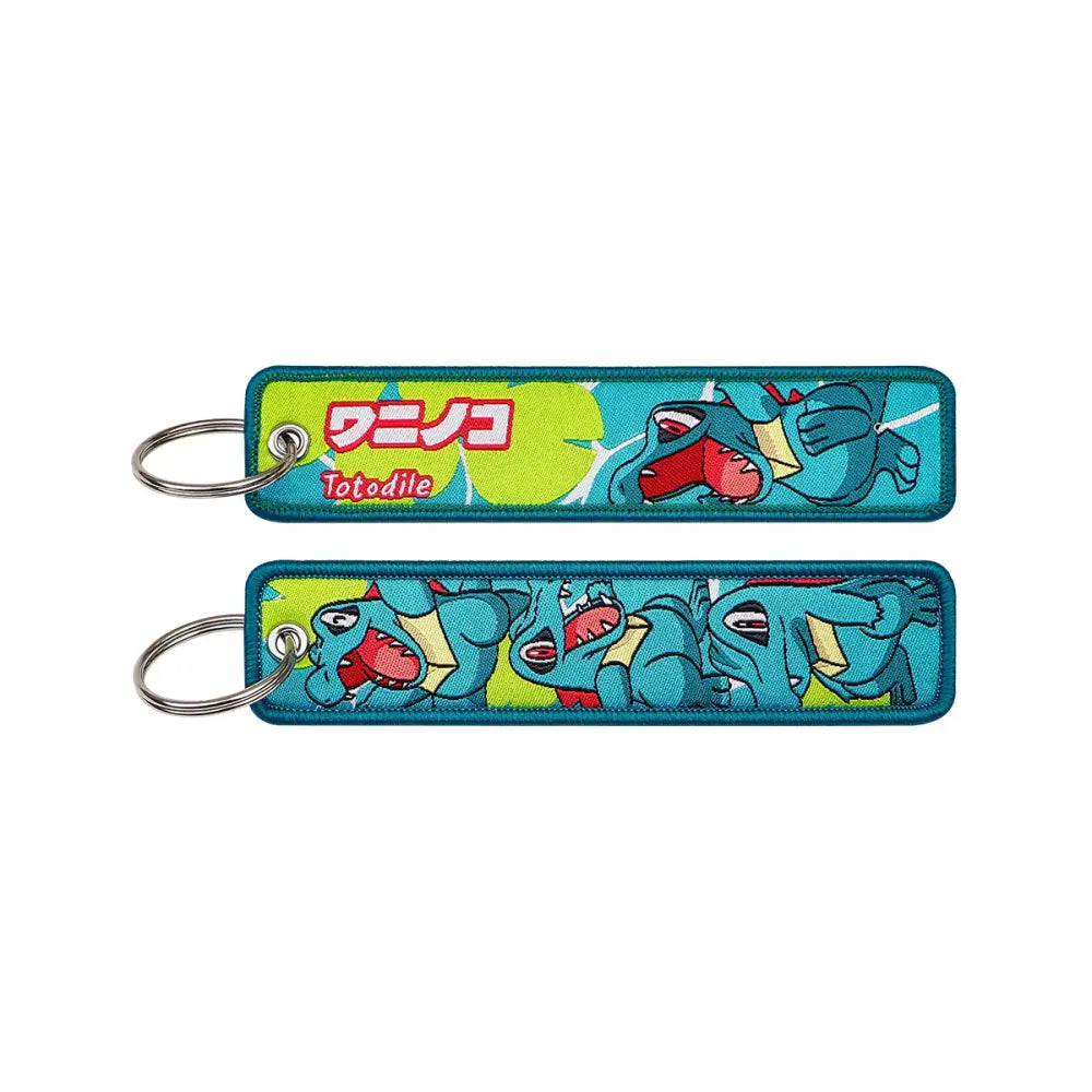 Blue embroidered totodile keychain with green and red accents pokemon pikachu embroidered keychain jet tag accessory