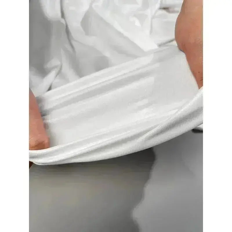 White soft cotton fabric of pokemon rayquaza graphic tee stretched to show its lightweight and stretchy texture