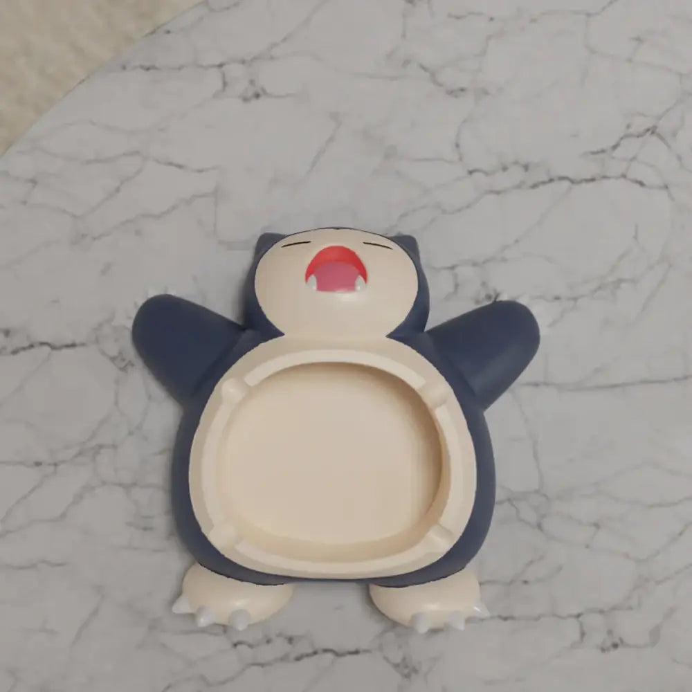 Pokemon Snorlax ashtray ornament in navy blue cream with red mouth designed as playful desktop decor accessory