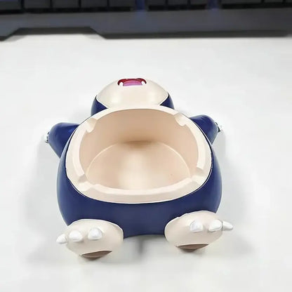 Blue and white snorlax-shaped ashtray with glossy plastic finish for desktop decor and smoking accessory use