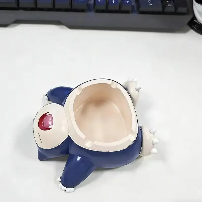 Blue and white snorlax-shaped ceramic ashtray ornament with red eye detail for desktop decor and smoking accessories