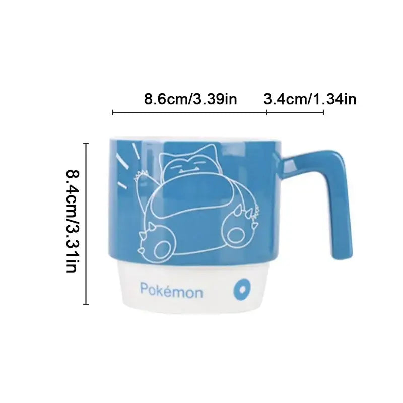 Blue and white ceramic mug featuring a kawaii style snorlax cartoon illustration for pokemon fans