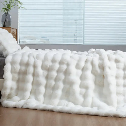 White plush faux rabbit throw blanket with soft fluffy texture for cozy warm comfort and thick faux fur feel