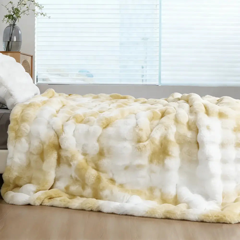 Plush faux rabbit fur throw blanket with soft white and golden-yellow gradient for cozy warmth and comfort