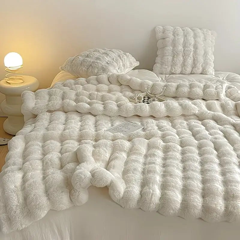 White plush faux rabbit blanket with soft textured faux fur for cozy warm and thick comfort