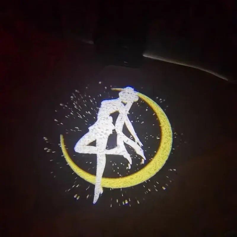 White and yellow sailor moon anime projector light displaying character on crescent moon for car door decoration
