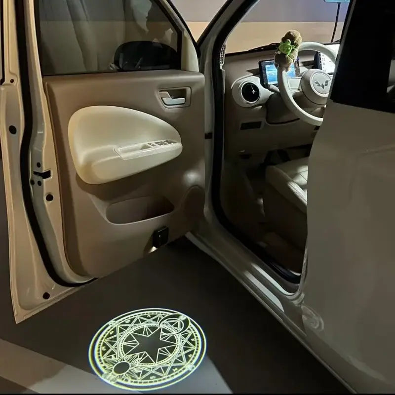 Sailor moon luna led projector lamp offers a glowing greenish-yellow geometric design projected on a car floor welcome light