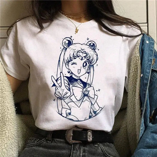 White cotton short sleeve graphic tee featuring blue ink-style sailor moon illustration making a peace sign