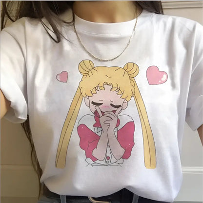 White cotton short sleeve graphic tee featuring a cute sailor moon cartoon with blonde pigtails and red bow
